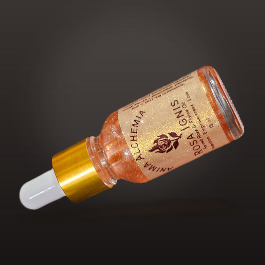 Rosa Ignis ritual oil lying on a dark background, showing the copper-red shimmer in the oil