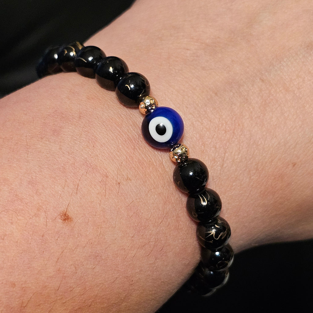 Evil Eye Protection Bracelet: Glass Beads & Gold Hematite Accent Beads in Gold Tone