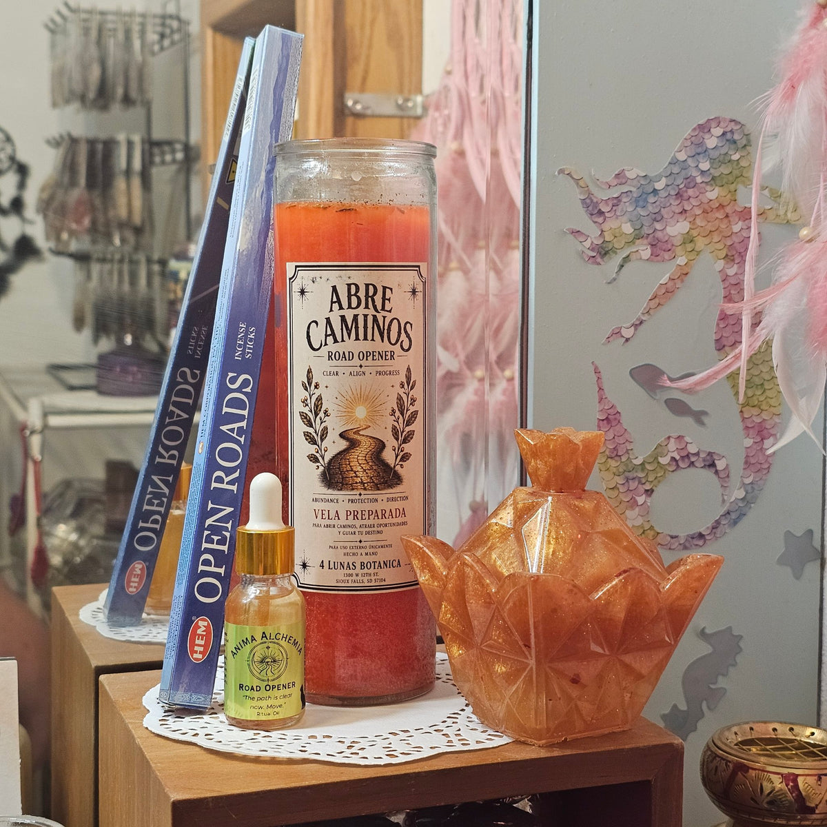 Abre Caminos ritual kit — candle, Road Opener ritual oil, Open Roads incense, golden-orange resin trinket jar (real photo)